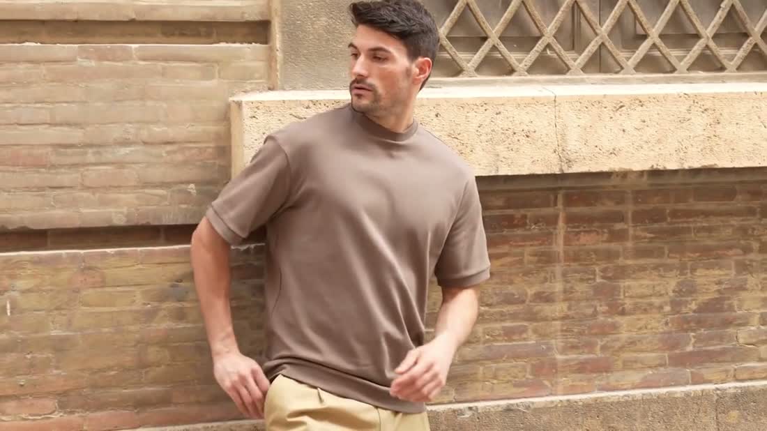 The same model with sleeves down and the Free Again print hidden inside